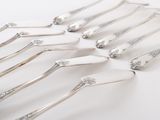 a lot of spoons that are sitting on a table