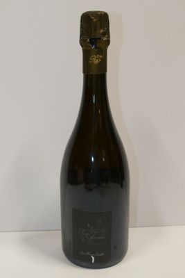 a bottle of wine that is sitting on a table