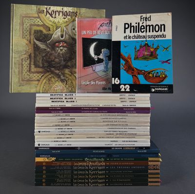 several books are stacked on top of each other on a table