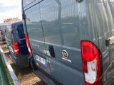 two vans parked next to each other on the side of the road