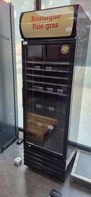 a refrigerator that is sitting in the corner of a room
