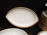 a lot of plates that are sitting on a table