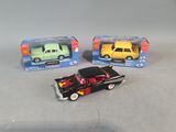 three toy cars that are sitting next to each other