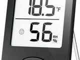 une image représentant un thermomètre numérique muni d'une horloge