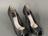 black high heeled shoes with open toe and peepy toes