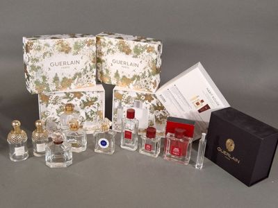 a lot of perfume bottles that are sitting on a table
