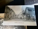 a black and white photo of a group of people on a street