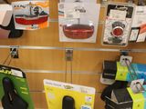 a wall of ear phones and headphones hanging on the wall