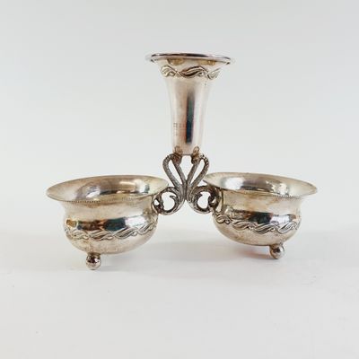 pair of silver plated candlesticks on stand with ornate design