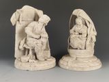 paire de figurines chinoises en ivoire sculpté représentant un homme et une femme