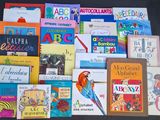 many children ' s books that are on the table
