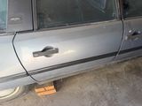 a car that is parked in a garage with its door open