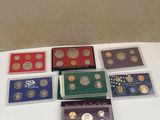 several different types of coins are sitting on a table
