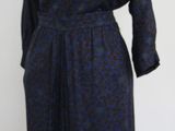 an image of a woman ' s dress on a mannequin stand