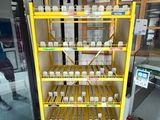 a display case with several bottles of soda in it