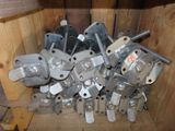 many different types of metal parts in a wooden box