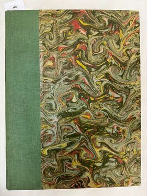 un vieux livre à la couverture verte ornée d'un motif marbré