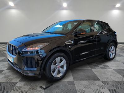 a black suv parked in a garage with a checkered floor