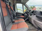 the interior of a van with two seats and a steering wheel