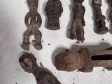 a lot of small wooden figurines on the table