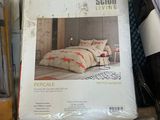 a box of bedding that is sitting on a bed