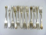 a lot of forks and spoons on the table
