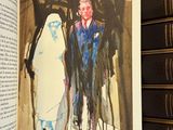 an open book with a picture of a man and a woman on it