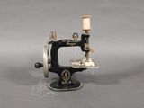 a small sewing machine that is sitting on a table