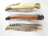 three different types of knifes on a white surface