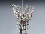 a sculpture of a woman made out of beads and beads