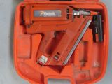 an orange box with a stapler and a stapler in it