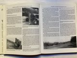 an open book with a picture of a plane on it