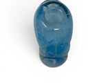 an image of a blue glass object on a white surface