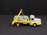 a toy truck with a crane on the back of it