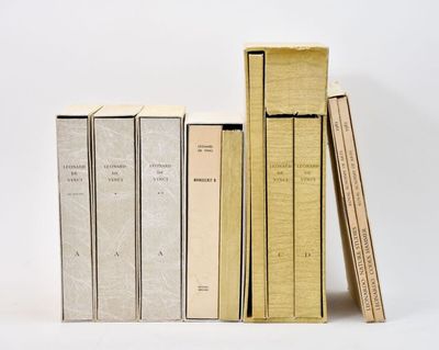 three books are stacked on top of each other on a white surface