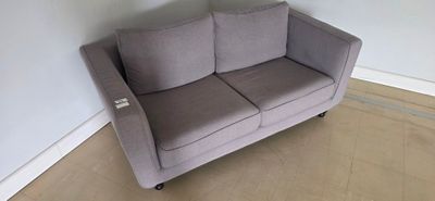 a couch that is sitting in the corner of a room