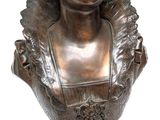 bronze bust of a young girl with a frillying collar