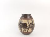 a brown vase with a picture of a horse drawn carriage on it