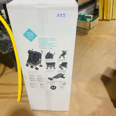 a box that has a baby stroller inside of it