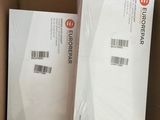 two boxes of electronic devices are sitting in a cardboard box