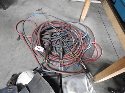 a lot of wires and tools on the floor