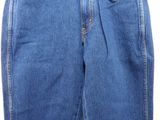 a close up of a pair of jeans on a hanger