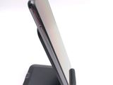 a cell phone that is sitting on top of a cell phone stand