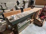 a picture of a workbench in a workshop with a lot of tools
