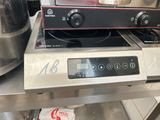 two stoves that are sitting on top of each other
