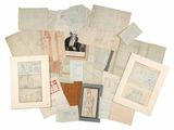 a lot of old papers and pictures on a white surface