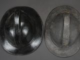 two helmets that are sitting next to each other on a table