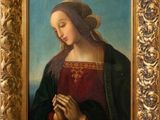 an image of a painting of a woman holding a rosary