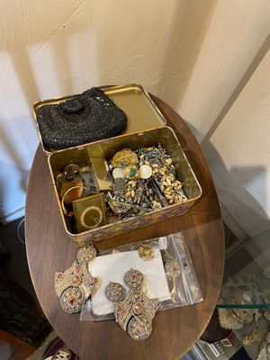 a small table with a lot of jewelry on it