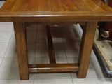 a wooden table with a bowl on top of it